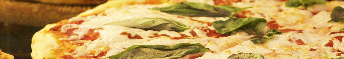 Eating Italian Pizza at Pope's Pizza restaurant in Saratoga Springs, NY.